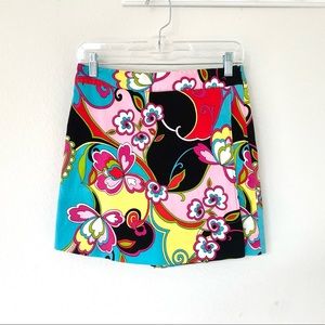 Bright multi color skort finished in a charming floral print.